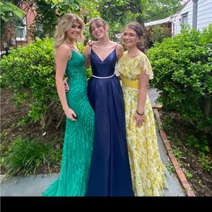 The blue dress in the middle it is a sherry hill dress in a size two